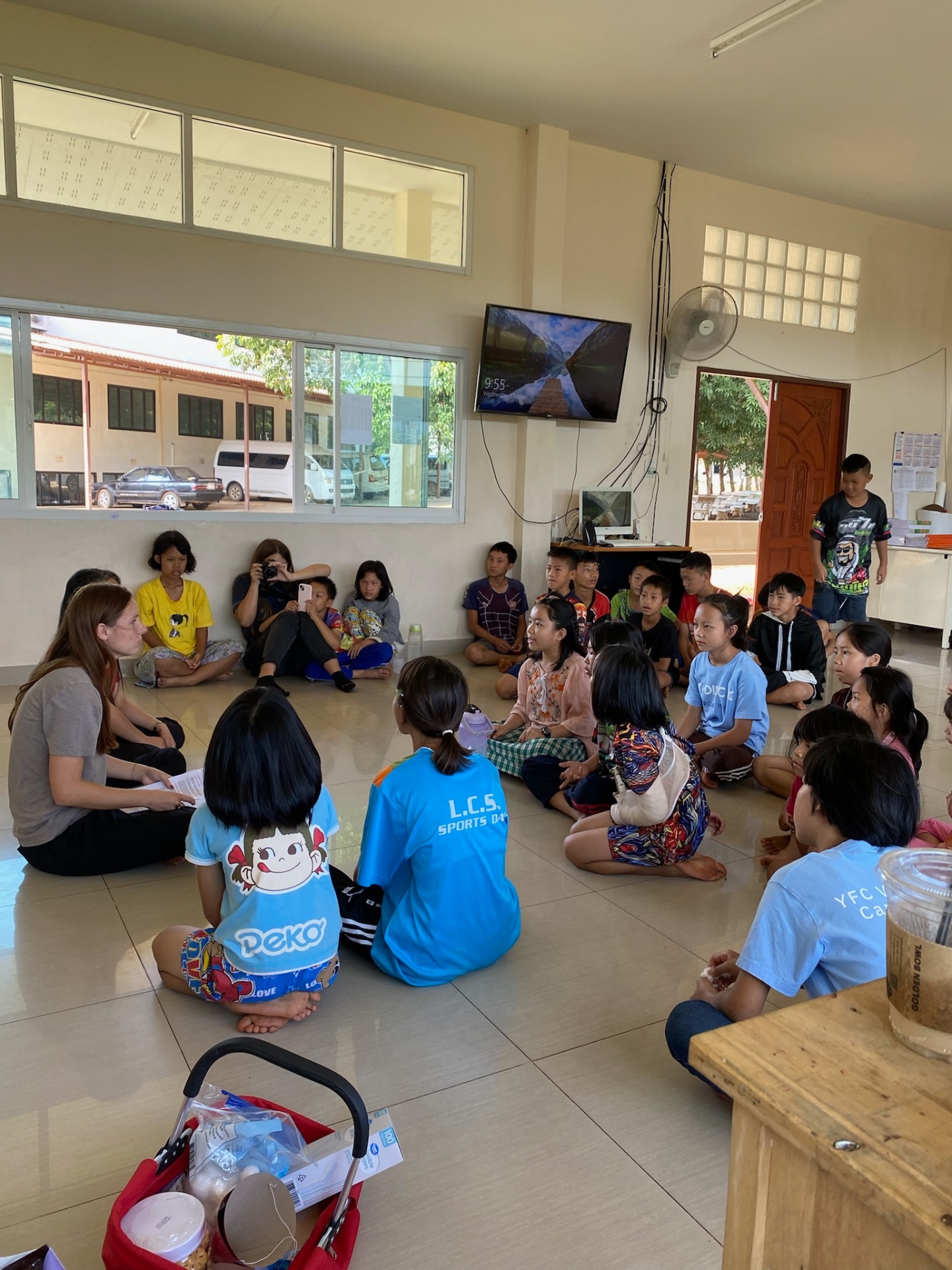 Team member leading a story circle with children