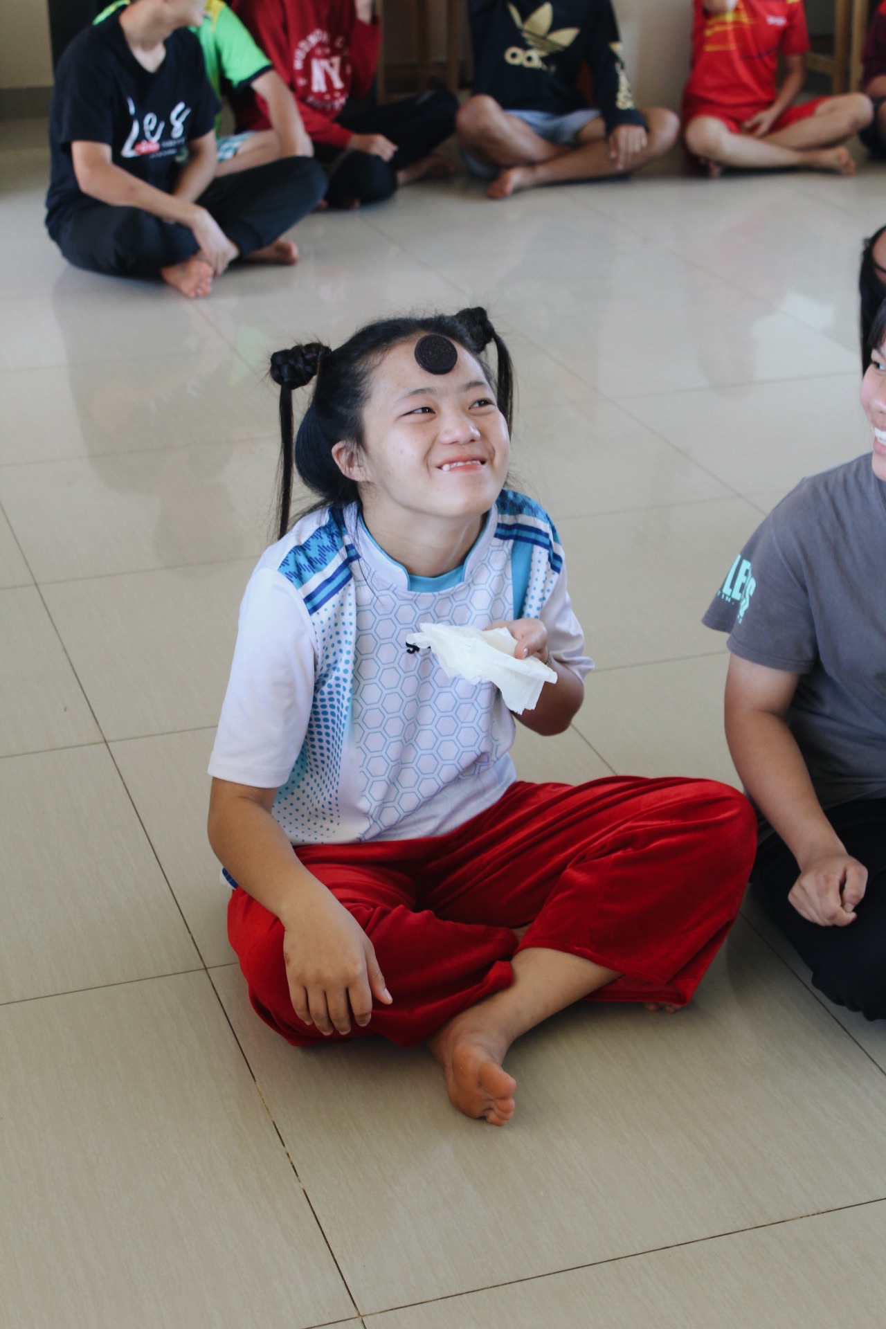 Girl laughing during a game with stickers