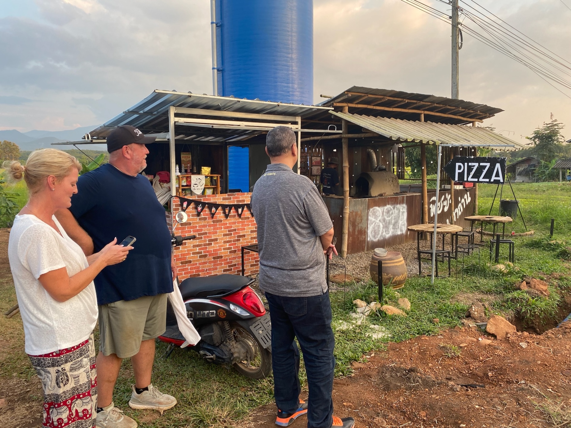 Team gathered at the village pizza stand